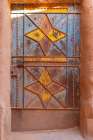 Ushaiger Heritage Village, Riyadh, Saudi Arabia. Painted metal door on an old mud brick building. Art Print